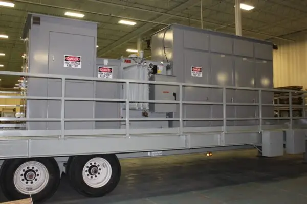 a large grey trailer with a metal door